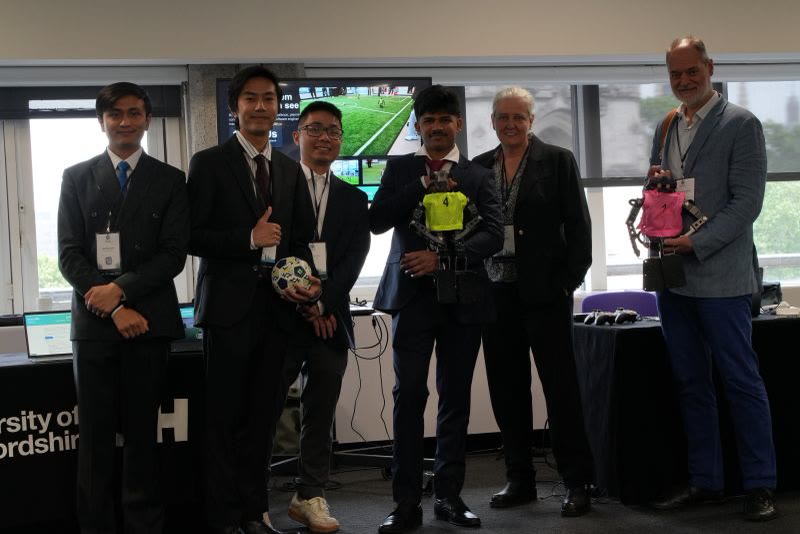 The team with both OP3s in front of the University of Hertfordshire stand at the QEII Centre